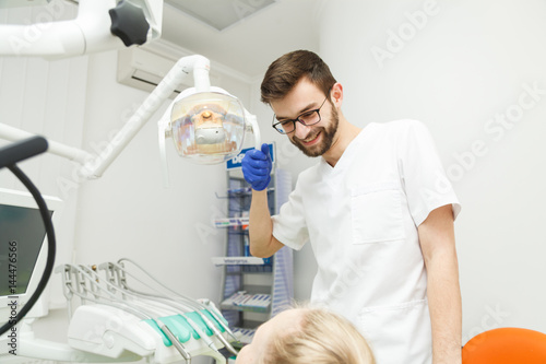 Male dentist and his patient