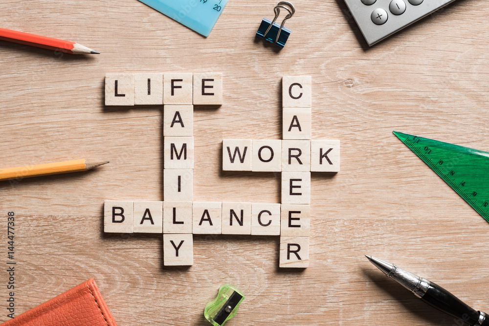 Words work life balance and family on table collected with wooden cubes