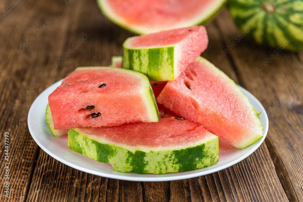 Portion of Fresh Watermelon on wooden background (selective focus). Portion of Fresh Watermelon on wooden background (selective focus).
