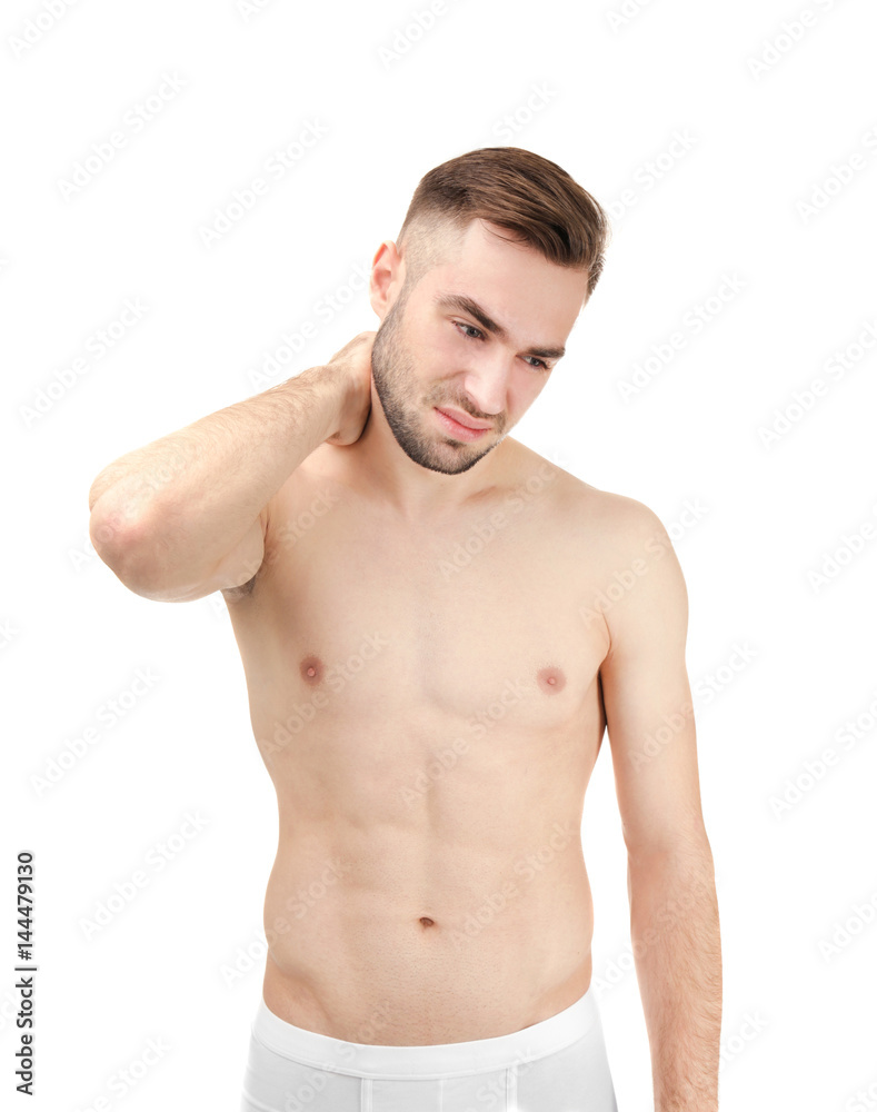 Fototapeta premium Young man suffering from neck pain on white background