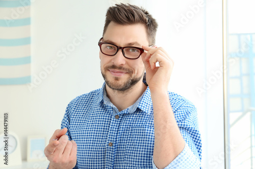 Young man with contact lens...