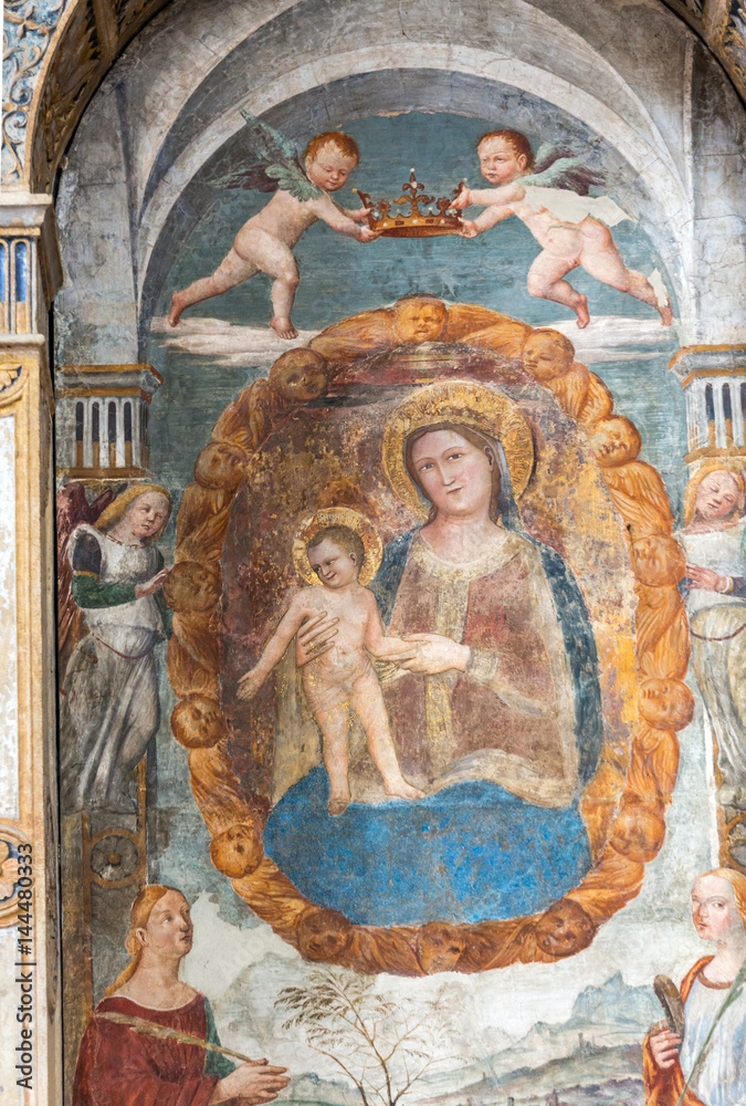 The Madonna with the child by Bonino da Campione in the church of The Eremitani (Chiesa degli Eremitani) on the tomb of Umberto da Carrara. Padua. Italy