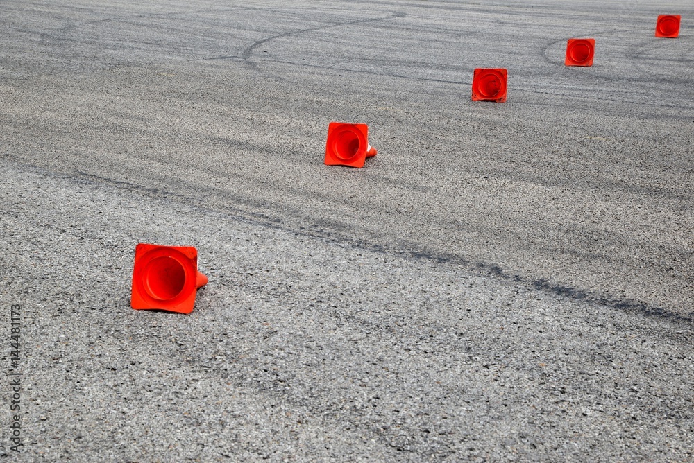 tire marks on the asphalt and posts a warning