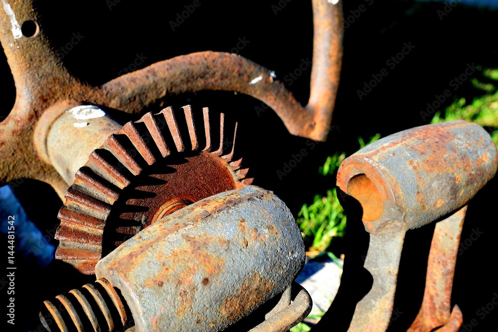 old agricultural machine modes covered with rust