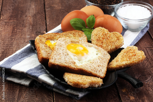 fried eggs and toast with basil pepper and salt