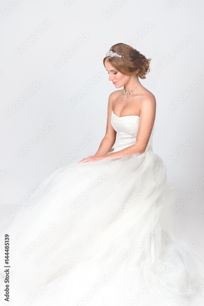 the bride sits in a jewelry - a necklace from pearls and in a crown the bride sits in a jewelry - a necklace from pearls and in a crown