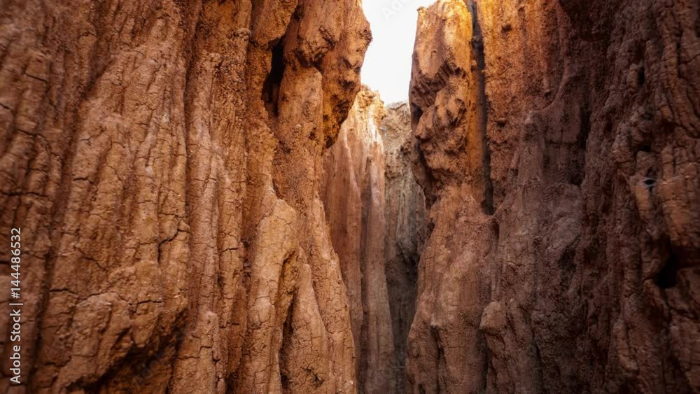 Pull-back linear timelapse from inside a cave of abstract eroded rock formations and sand full of texture and grain with changing light at sunrise available on request. Pull-back linear timelapse from inside a cave of abstract eroded rock formations and sand full of texture and grain with changing light at sunrise available on request.
