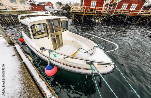 Fishing vessel at the pier of traditional fishing settlements of Lofoten islands. Beautiful Norway landscape.