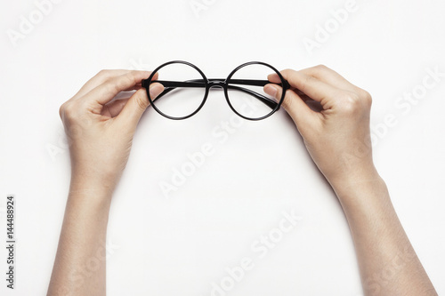 woman(female) hand hold a glasses isolated white.