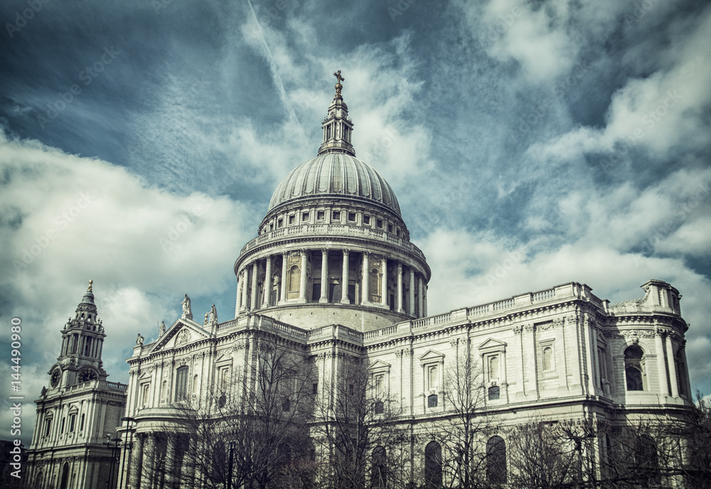 Saint Paul's Cathedral in London, England, UK with dramatic cloudy sky in background