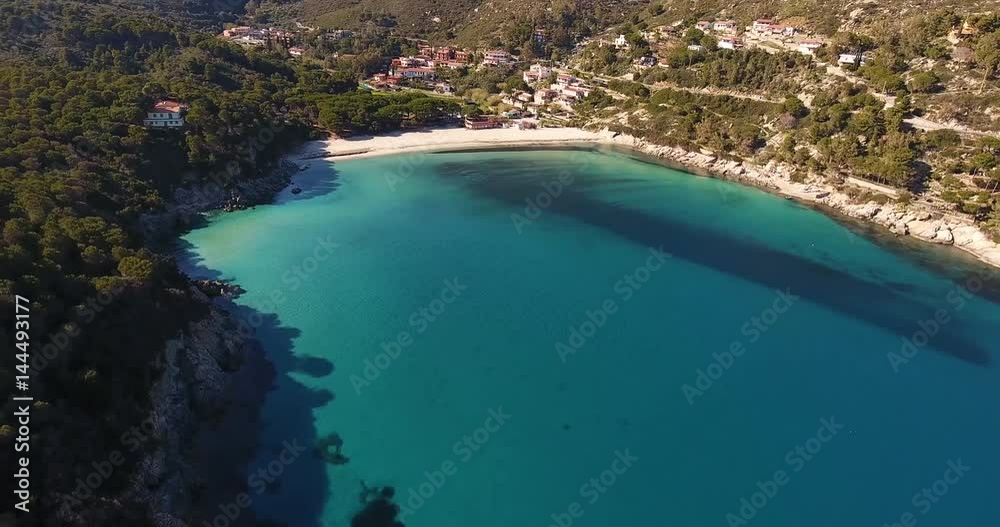 Aerial shot of a beautiful cove and paradisiac sea near Elba island in Tuscany, Italy, 4K Aerial shot of a beautiful cove and paradisiac sea near Elba island in Tuscany, Italy, 4K