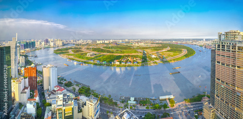 Ho Chi Minh City, Vietnam - April 11, 2017:Panorama High view Saigon skyline when the sun shines down urban with tall buildings along river showing development of country in Ho Chi Minh City, Vietnam © huythoai