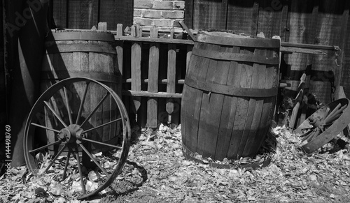 Old western barrels and wagon wheel black and white