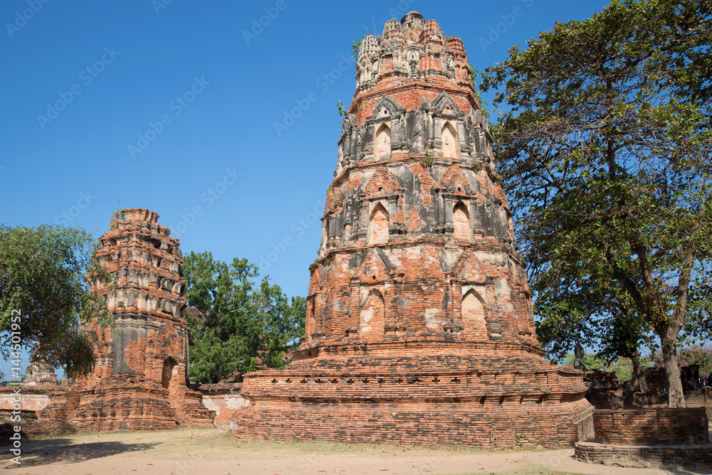 Ancient prangs of Buddhist temple Wat Mahathat on a sunny day. Ayutthaya, Thailand Ancient prangs of Buddhist temple Wat Mahathat on a sunny day. Ayutthaya, Thailand