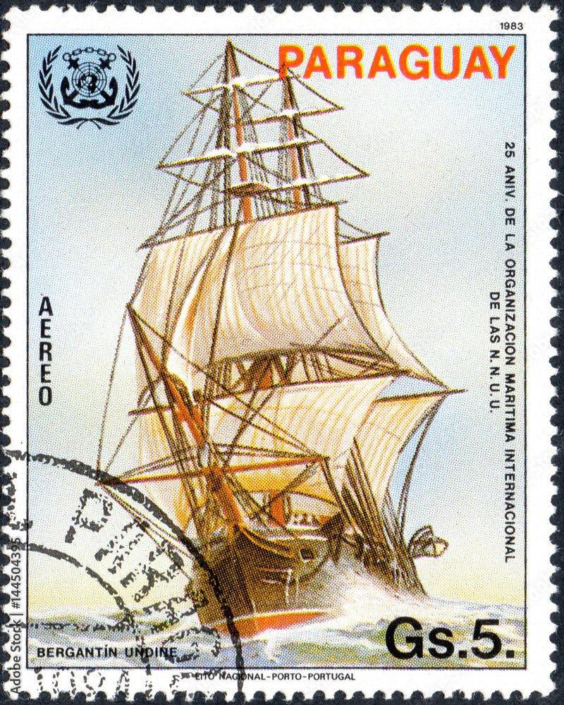 UKRAINE - CIRCA 2017: A postage stamp printed in Paraguai shows sailing ship brigantine Undine, from the series 25 years of international Maritime Organization IMO, circa 1983