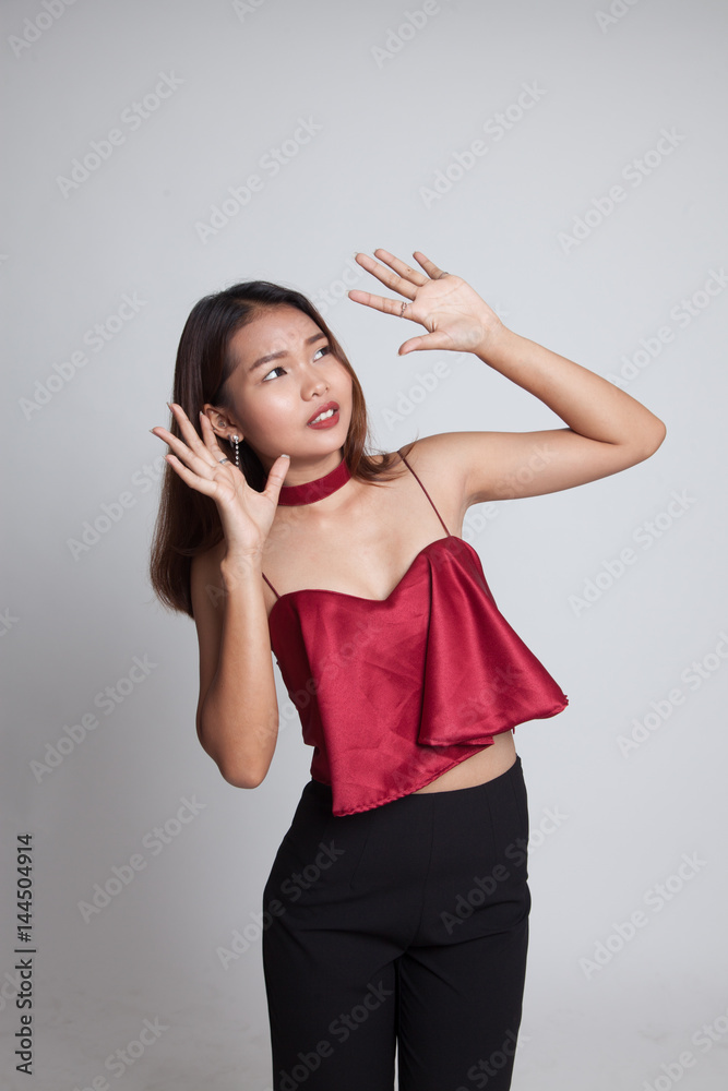 Excited young Asian woman look up. Excited young Asian woman look up.