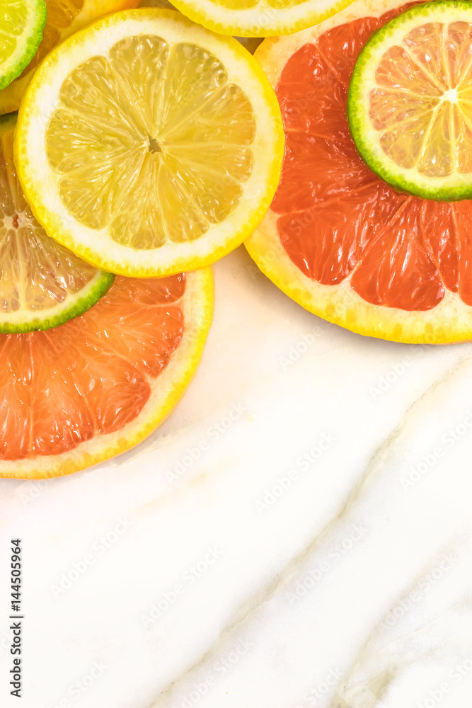 Grapefruit, lime, and lemon slices with copyspace Grapefruit, lime, and lemon slices with copyspace