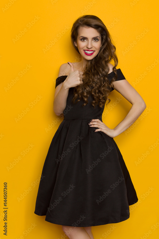 Smiling Elegant Woman In Black Dress Gives Like Smiling Elegant Woman In Black Dress Gives Like