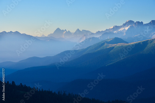The first rays of the sun illuminate the mountain in the Western Caucasus © Vitalfoto