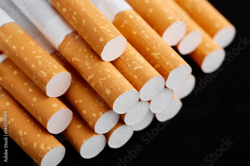 cigarette close up isolated on blak background. Drug addiction. Tobacco smoking. cancer. Nicotine. Bad habit.