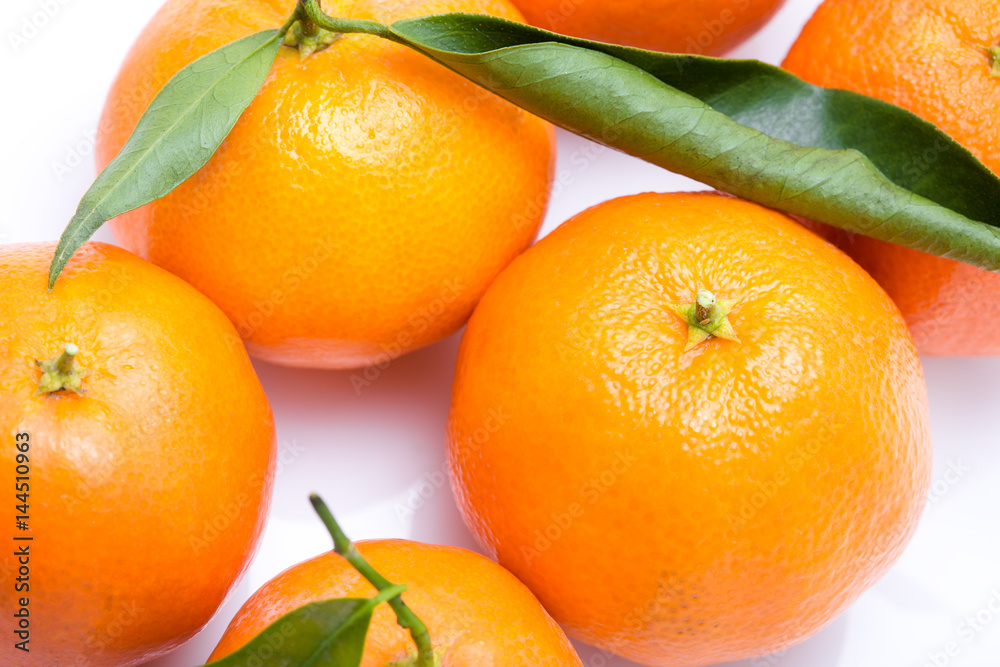 Ripe mandarin close-up on a white background. Tangerine orange. Colorful Food and drink still life concept. Fresh fruits. Clementine. Citrus. Diet. Vitamins. Healthy food. Ripe mandarin close-up on a white background. Tangerine orange. Colorful Food and drink still life concept. Fresh fruits. Clementine. Citrus. Diet. Vitamins. Healthy food.