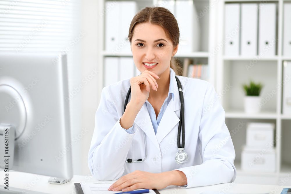 Latin american doctor woman standing with arms crossed and smiling at hospital. Physician ready to examine patient. Health care, insurance and help concept. Physician ready to examine patient Latin american doctor woman standing with arms crossed and smiling at hospital. Physician ready to examine patient. Health care, insurance and help concept. Physician ready to examine patient