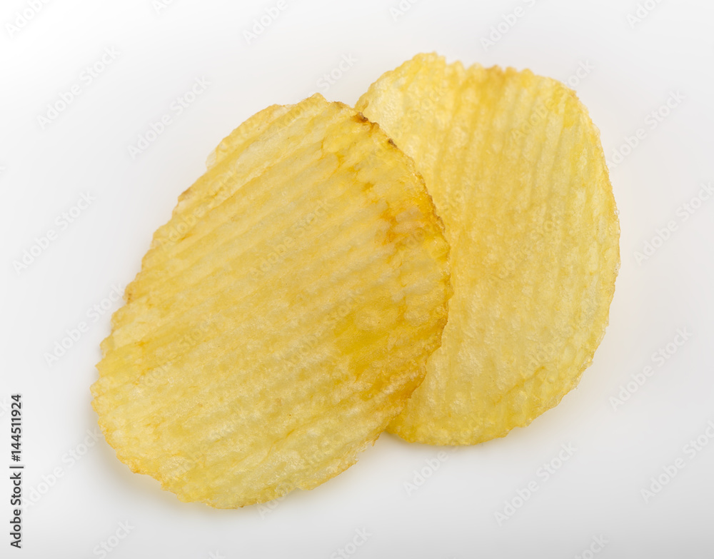 Crispy potato chips. Fast Food. Potatoes. Fatty unhealthy foods. corrugated chips Crispy potato chips. Fast Food. Potatoes. Fatty unhealthy foods. corrugated chips