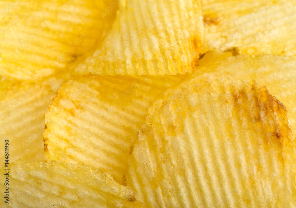 Crispy potato chips. Fast Food. Potatoes. Fatty unhealthy foods. corrugated chips Crispy potato chips. Fast Food. Potatoes. Fatty unhealthy foods. corrugated chips