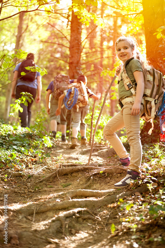 Children scouts explore the beautiful forest