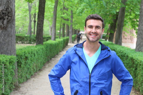 Handsome healthy male smiling in the park 