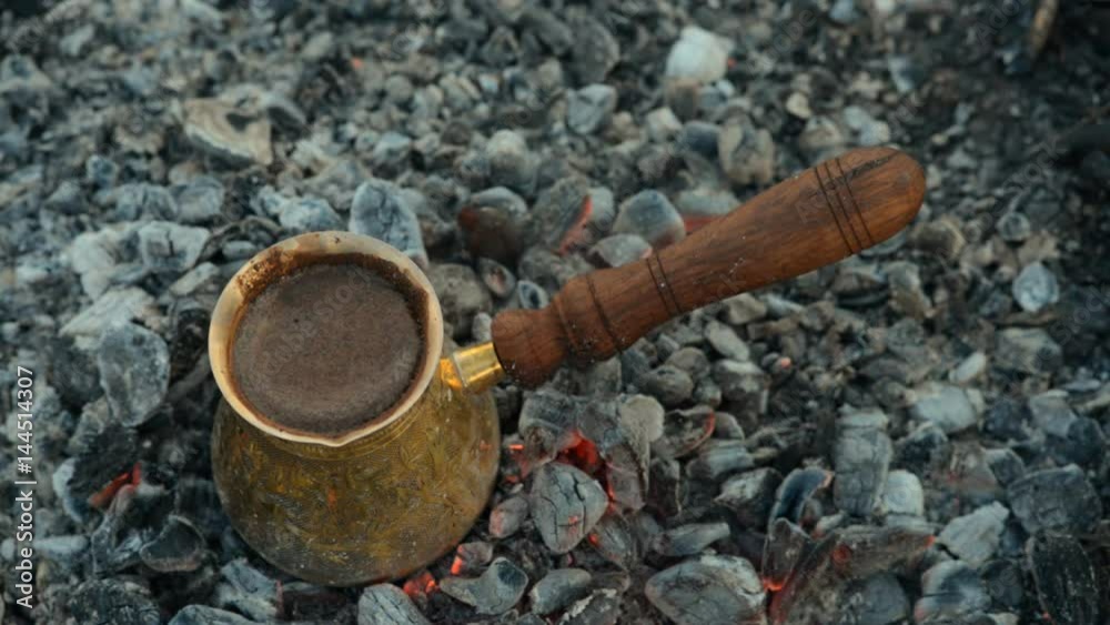 Traditional process boil Turkish coffee on coals. Traditional process boil Turkish coffee on coals.