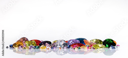 Colorful of different gemstones with space for text on white background. photo