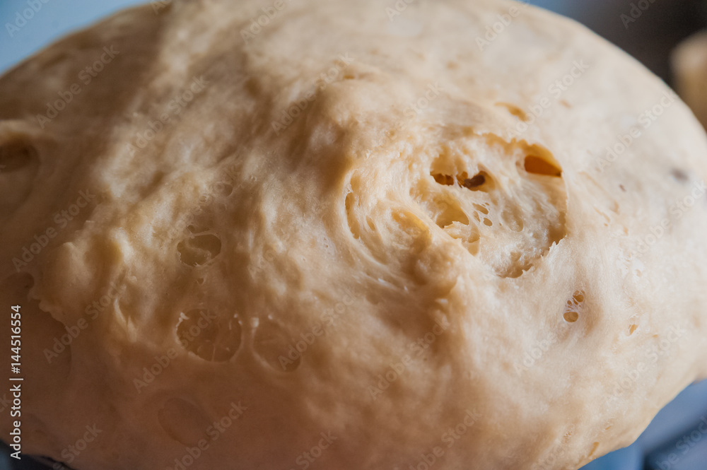 Dough. Dough for pies, bread, cakes, biscuits. Flour product in a black large saucepan Dough. Dough for pies, bread, cakes, biscuits. Flour product in a black large saucepan