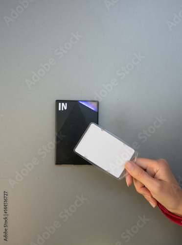 Asian business man hand holding Access card / Key Card eletronic door accessing control scanning to lock and unlock door. Security scan door open / close Automatic Technology system concept