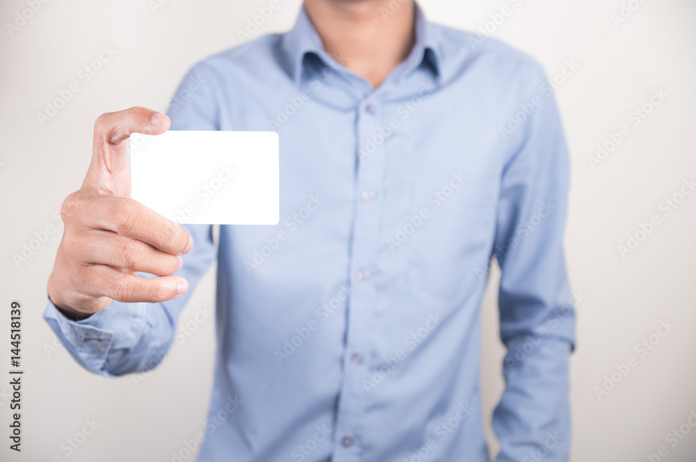High angle view of man showing the blank bussiness card in hand High angle view of man showing the blank bussiness card in hand