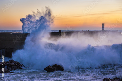Big waves smashes on breakwater in Porto, Portugal