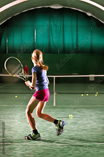 Young girl plays tennis at indoor court