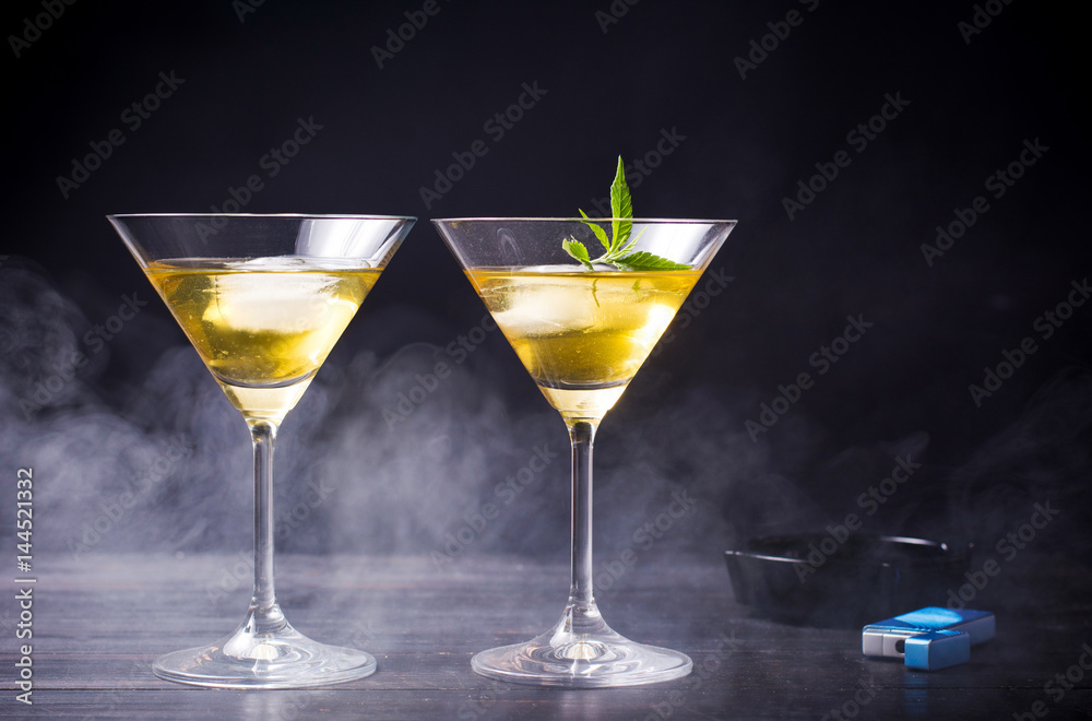 Marijuana cocktails against black background