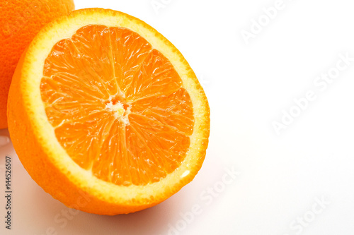 Orange cut in half on white background  selective focused.