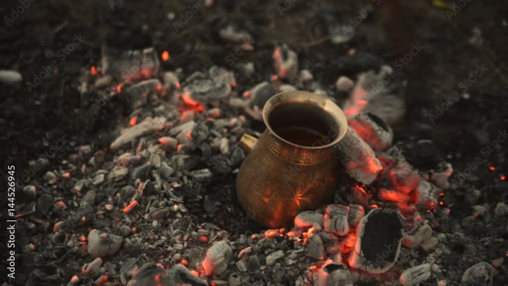 Traditional process boil Turkish coffee on coals. Traditional process boil Turkish coffee on coals.