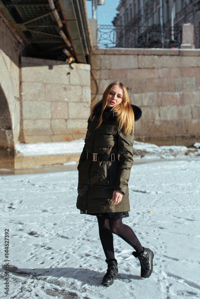 Picture of a girl against a background of snow and the city Picture of a girl against a background of snow and the city