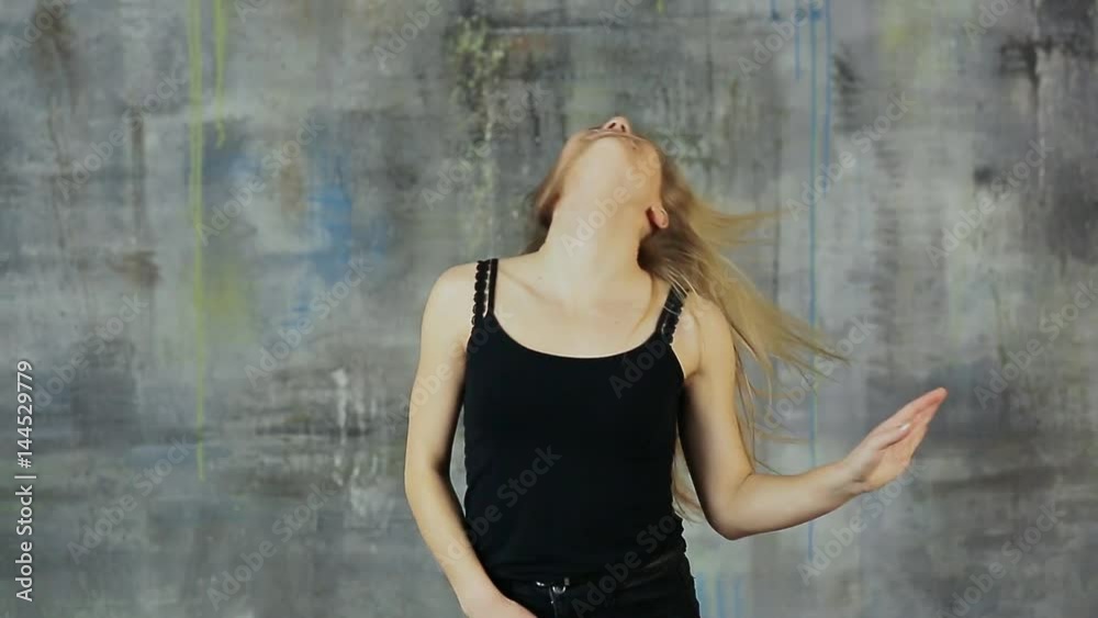 Girl teenager blonde dancing dance with her hair rotating her head. Girl teenager blonde dancing dance with her hair rotating her head.