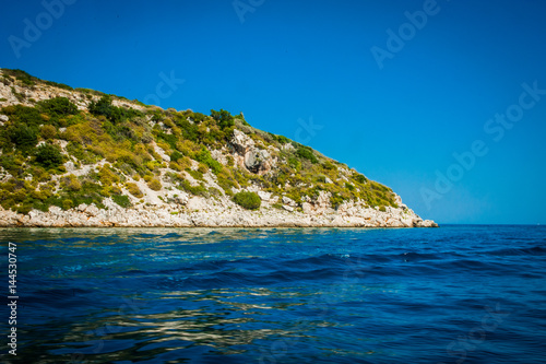 Obraz na płótnie Greece, Zakynthos, August 2016. Rocks, caves and blue water w salonie