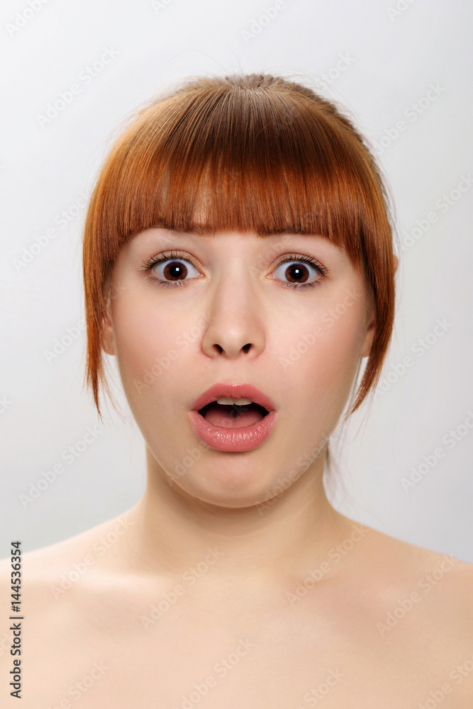 close-up studio portrait of a young beautiful woman demonstratin close-up studio portrait of a young beautiful woman demonstratin