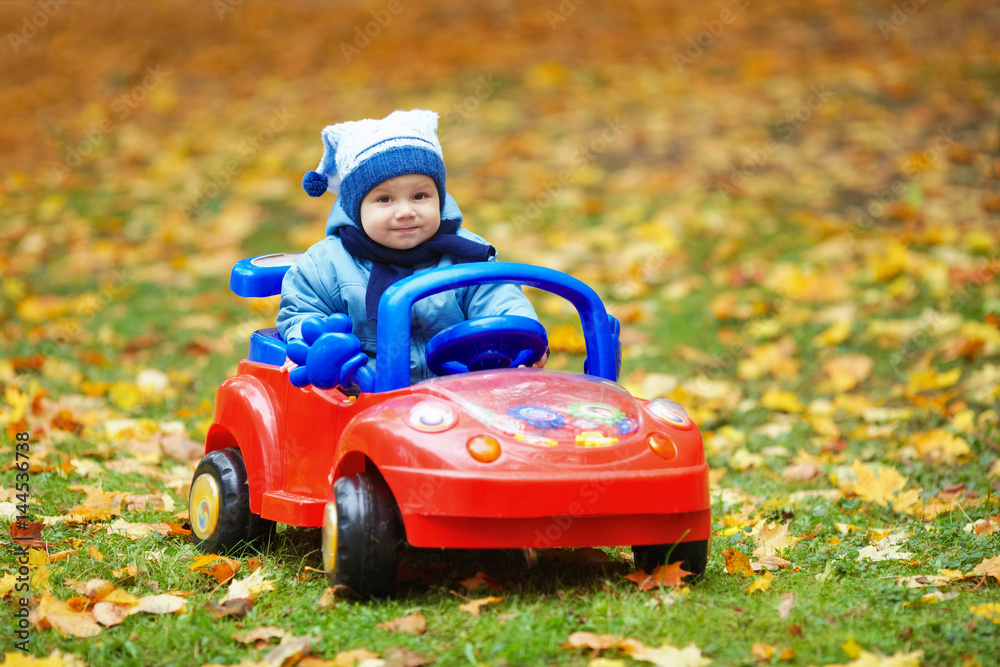 little funny boy driving toy car little funny boy driving toy car