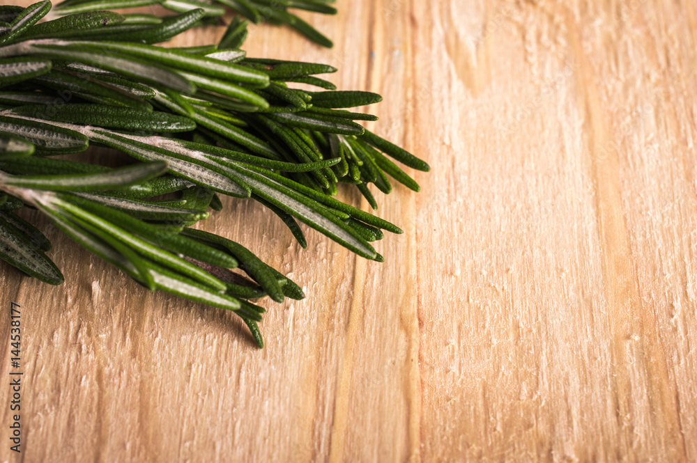 Rosemary on a wooden background Rosemary on a wooden background