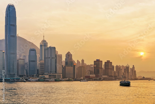 Star ferry at Victoria Harbor in Hong Kong at sundown