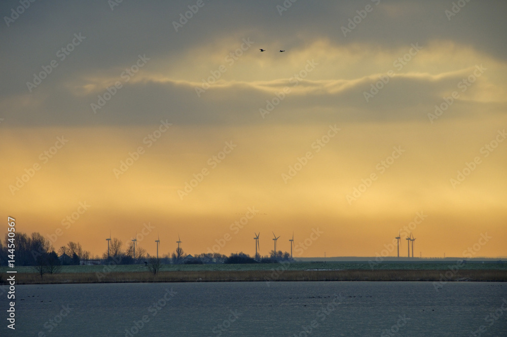 Sillouettes of windsmills in Marken, the Netherlands