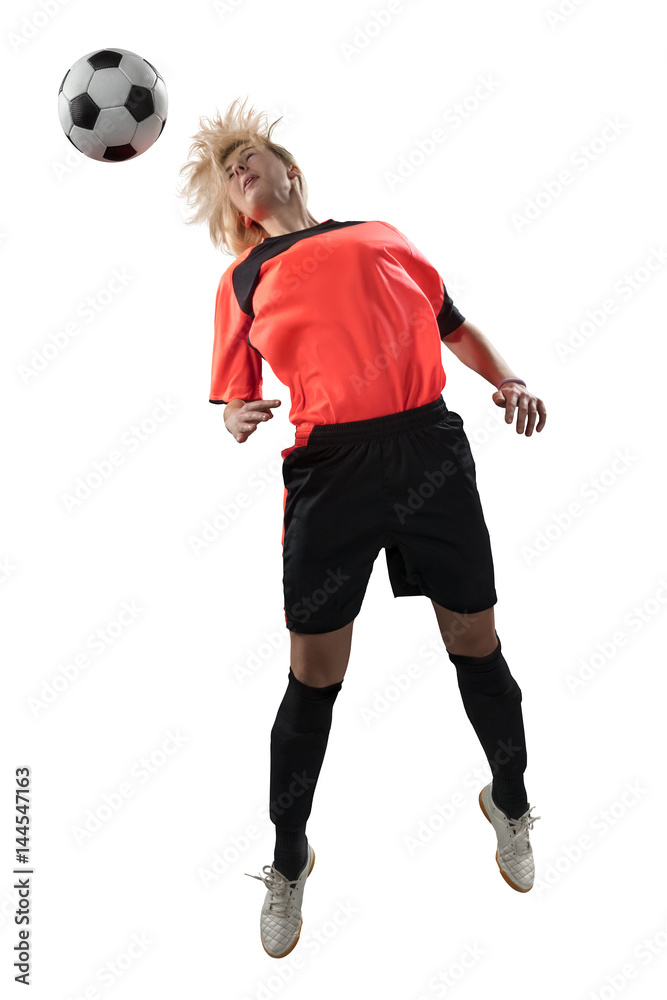 Female soccer player jumping for the ball isolated