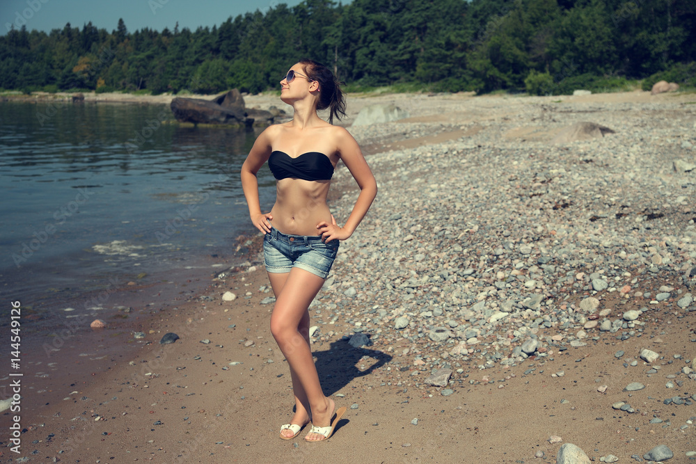 Fototapeta premium portrait beautiful smiling woman in black bikini